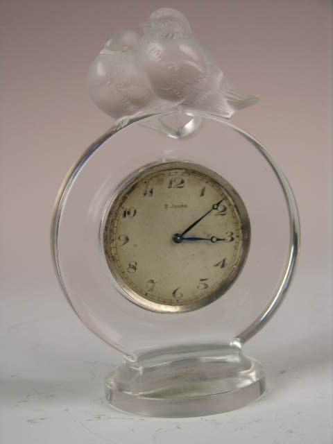 A rare R. Lalique "Pierrots" desk clock : A rare R. Lalique "Pierrots" desk clock In clear and frosted glass. Acid etched "R. Lalique France" on the bottom. Height 5 1/8".