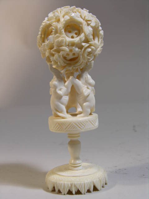 Chinese carved ivory puzzle ball on elephant stand: Chinese carved ivory puzzle ball on elephant stand, unsigned. 4 ¼"