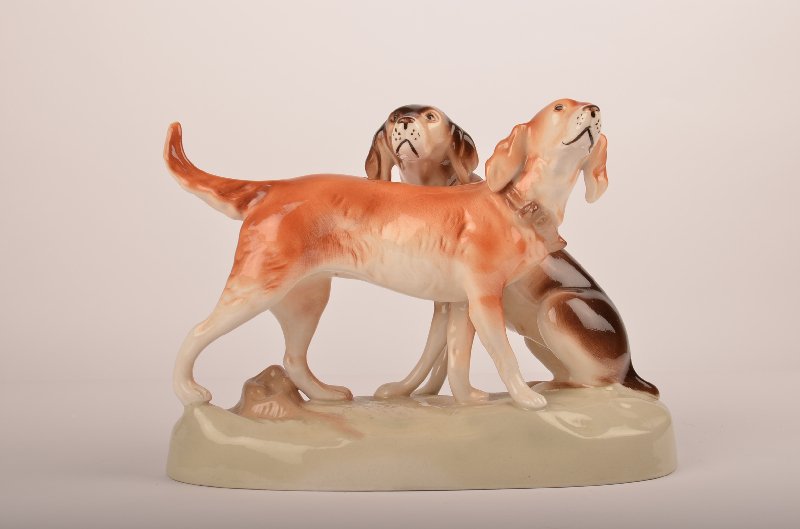 Royal Dux porcelain figure of two dogs. H: 8" W: 1: Royal Dux porcelain figure of two dogs. H: 8" W: 11" D: 5"