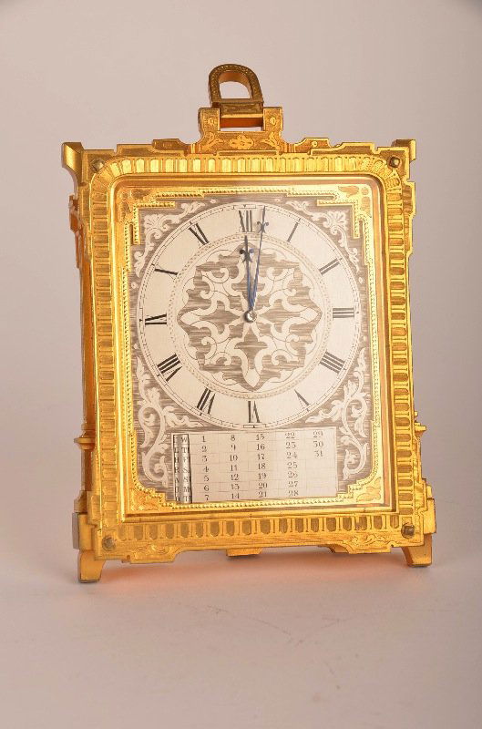 Thomas Cole (English: 1800-1864) rectangular gold gilt : A superb Thomas Cole (English: 1800-1864) rectangular gold gilt strut clock with an engraved silver dial with painted black roman numerals and calendar. Number stamped 1698 on the bottom of the outsid