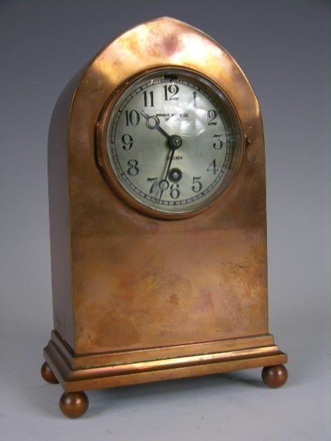 CHELSEA MANTLE CLOCK.: A VERY NICE LANCET SHAPED BRONZE DESK CLOCK WITH A CHELSEA CLOCK COMPANY MOVEMENT. SUPPORTED ON FOUR BALL FEET. THE FACE STAMPED " WRIGHT, KAY & CO. DETROIT" AS WELL AS "CHELSEA". THE MOVEMENT STAMPED