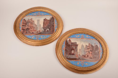 Antique pair of painted wall plaques.: Antique pair of painted wall plaques.Each plaque of a European village scene with a rectangular cartouch on a blue background with flowers and vines.