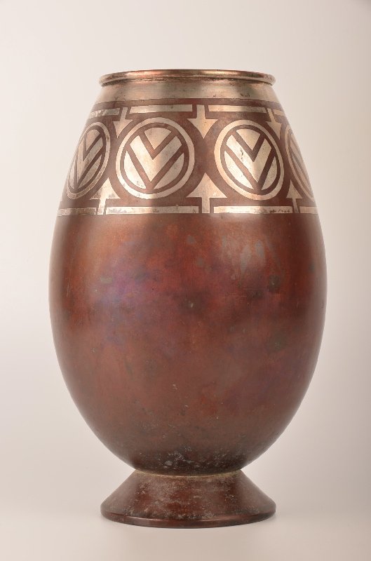 A Christofle French vase circa 1920. This vase with: A Christofle French vase circa 1920. This footed vase with geometric pattern in the dinanderie production from Christofle. Stamped on the bottom "Christofle B 157 G". Height 10 3/8 ".