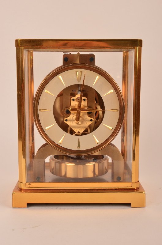 Atmos Le Couture 15 Jewel round faced Swiss perpetual: Atmos Le Couture Swiss 15 Jewel round faced perpetual mantle clock. Serial number 77797. Height 8 3/4". Circa 1950.