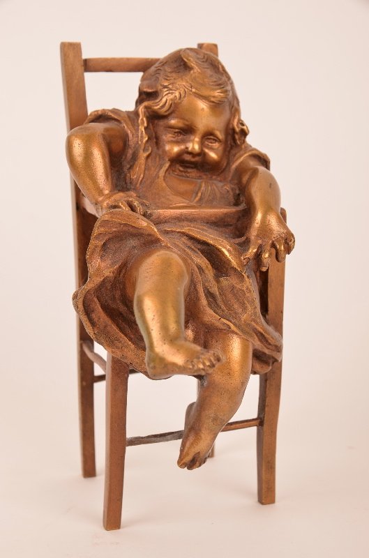 Juan Clara (Spanish 1875-1957) bronze figure.: Juan Clara (Spanish 1875-1957) bronze figure. Juan Clara bronze figure of a little girl (Suzette). Standing on a high chair. Signed "Juan Clara" in the bronze. Overall height 13 1/2 ".Circa 1920.