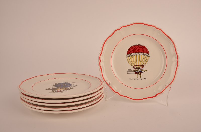 Set of six hot air balloon plates.: Set of six hot air balloon plates. Each with a different title and with a double red boarder. Marked on the back Longchamp France. Diameter 7 1/2'