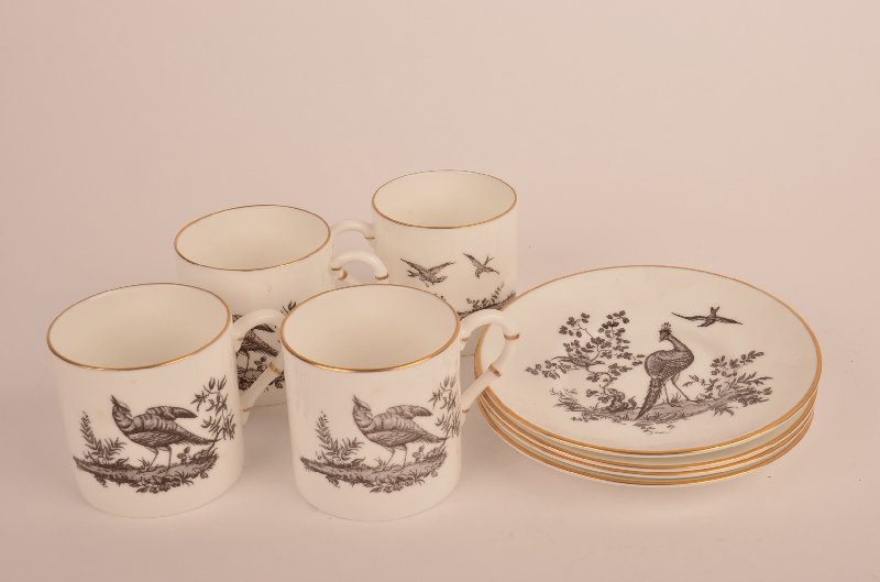 Set of four Royal Worcester English cups and saucers.: Set of four Royal Worcester English cups and saucers. Decoratred with peacocks, birds and foilage. Cup size 2 1/4" high., saucer diameter 4 3/4".
