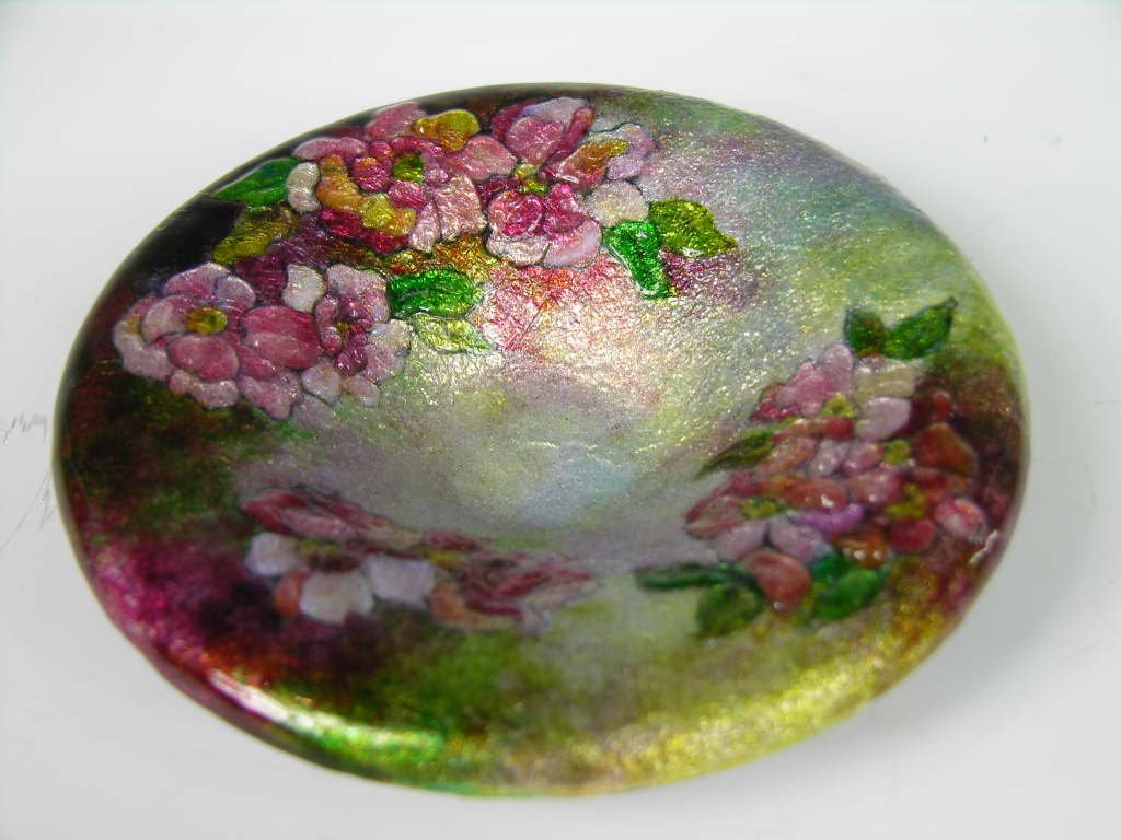Camille Faure enamelled dish.: Camille Faure enamelled dish.Decoratd with flowers all around on a green and rose background. Signed "C. Faure".Diameter 4 7/8 inches. Circa 1920.