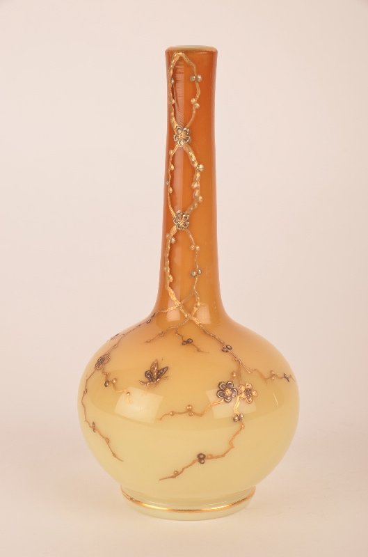 Attributed to Thomas Webb vase decorated with enamelled: Attributed to Thomas Webb vase decorated with enamelled flowers running up the side on a cream to carmel ground.Height 7 3/8 inches.