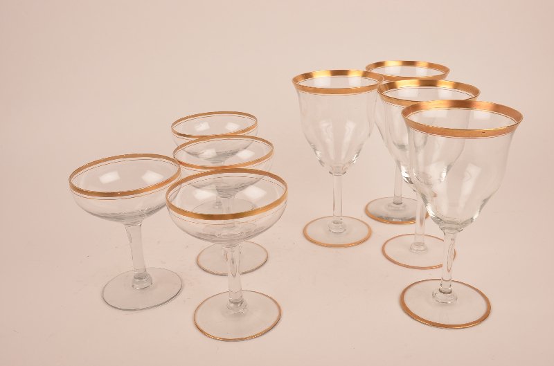 Eight gold rimmed glasses, four ed glasses, four: Eight gold rimmed glasses, four champagn and four wine glasses.