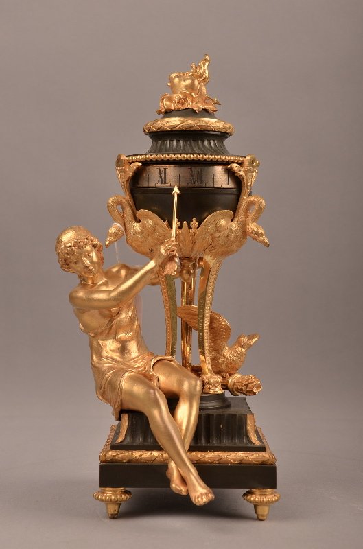 Annular clock with a beautiful lady with an arrow.: Annular clock with a beautiful lady with an arrow and a large Eagle perched on a cach of arrows. Overall height 10 1/2 inches.