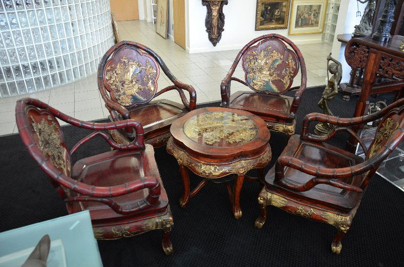 Antique Chinese four chair and small center table: Antique Chinese four chair and small center table heavly carved and high lighted in gold paint.We recomend that a prospective verify this wood as it may be avery rare wood called ZitanChairs measure a