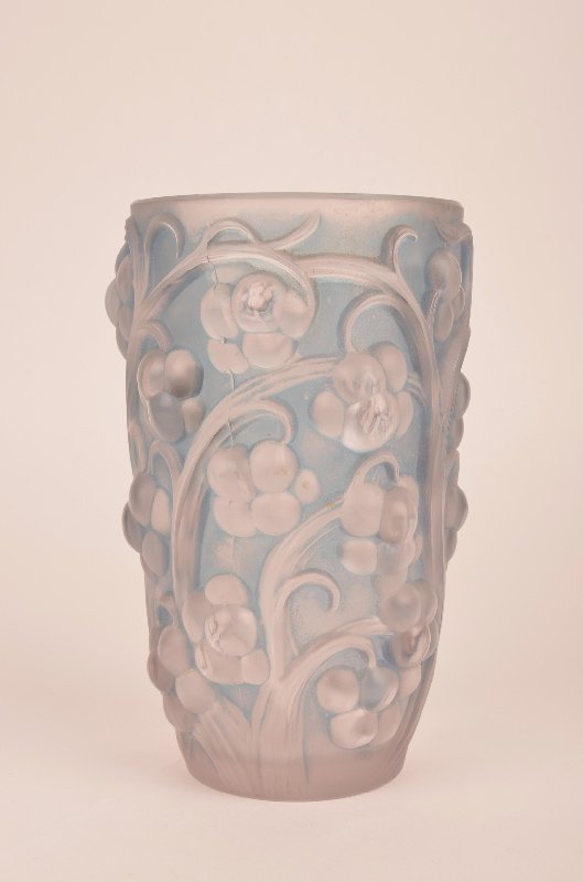 Rene Lalique "Raisins" vase in clear glass with a light: Rene Lalique "Raisins" vase in clear glass with a light blue patina. Decorated in high relief grapes and vines all around. Acid etched R. Lalique France on the bottom. Circa 1927. Height 6 5/16 inches