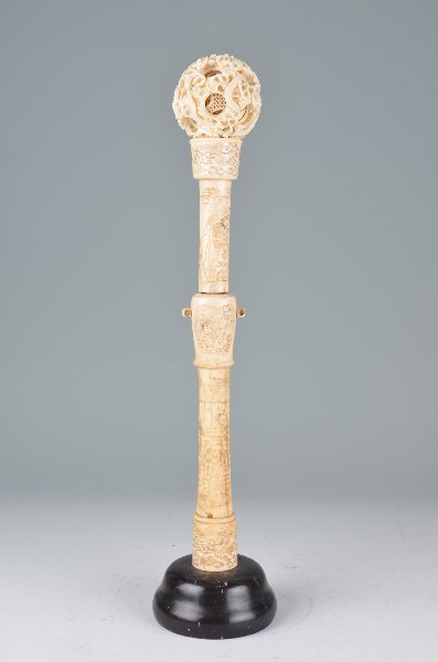 A carved Chinese 6 ball puzzle.: A carved Chinese 6 ball puzzle. Supported on a wood base. Height 16 1/2 inches.(Some slight damage to interior balls).