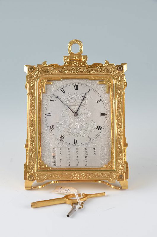 A Thomas Cole circa 1852 rare engraved calandar strut: A Thomas Cole circa 1852 rare engraved calandar strut clock with an engraved silver dial of foliage all around and a coronet with in the center. The hours of the clock with painted roman numerals. Fle