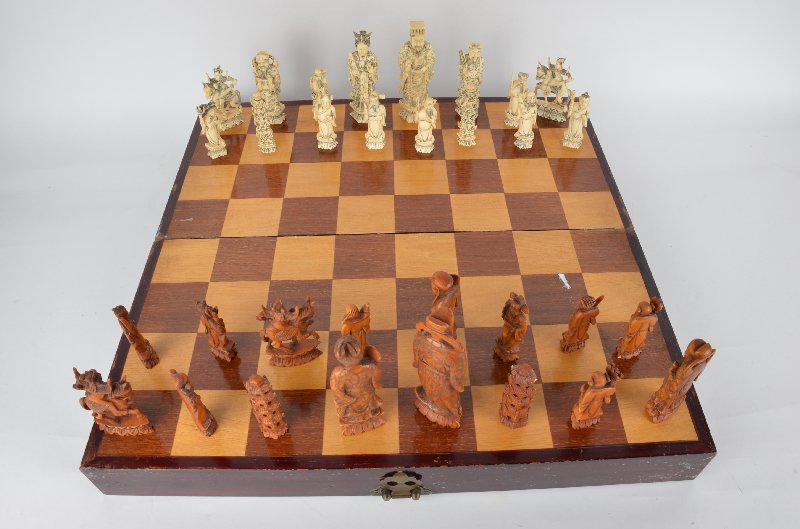 Thirty two piece carved ivory chess set with seperated: Thirty two piece carved ivory chess set with seperated lined dividers.Largest piece 6 inches.