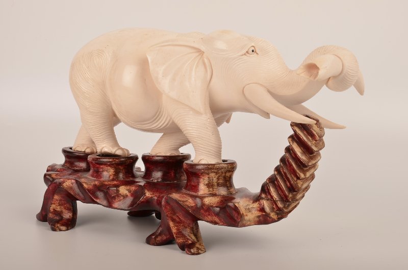 Carved  elephant with his trunk up. (1 of 4)