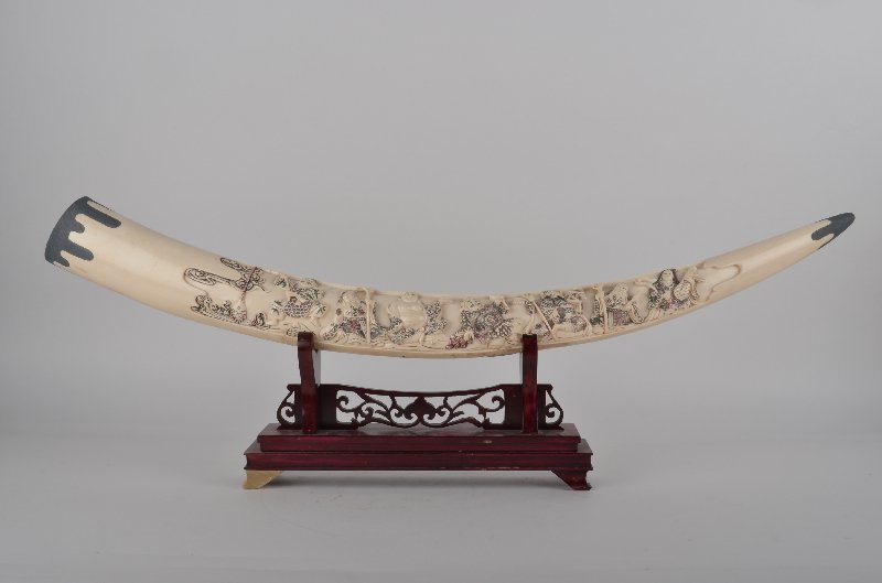 Carved figurines mounted on a wood base. (1 of 7)