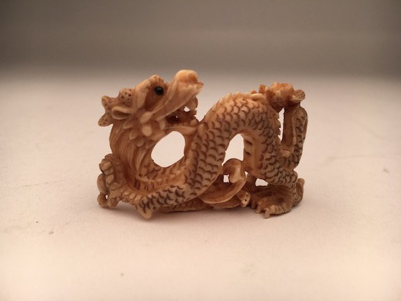 A carved Netsuke figure of a Dragon (1 of 3)
