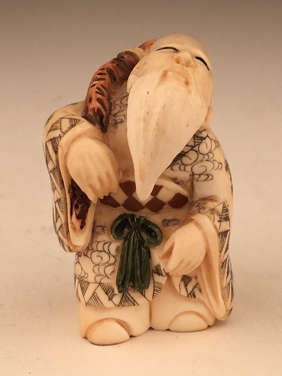 Carved Japanese polychromed netsuke of a bearded man (1 of 6)