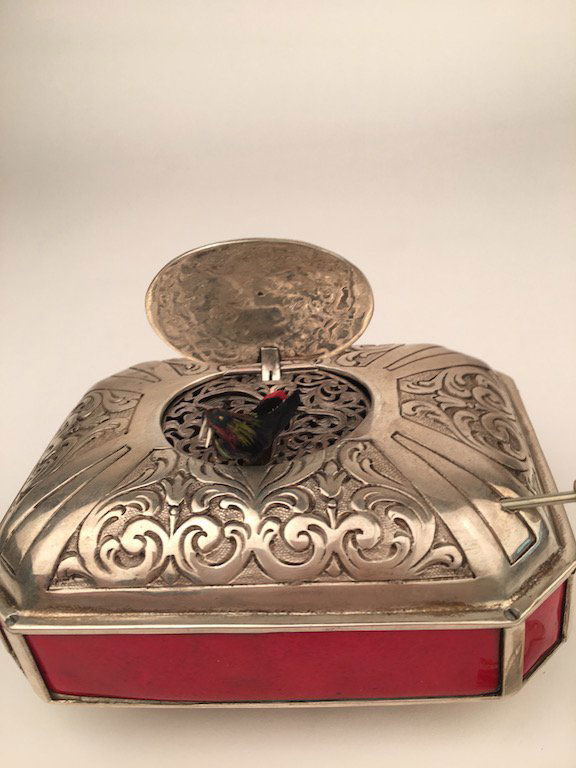 Mechanical singing bird box with red enamel panels. (1 of 4)