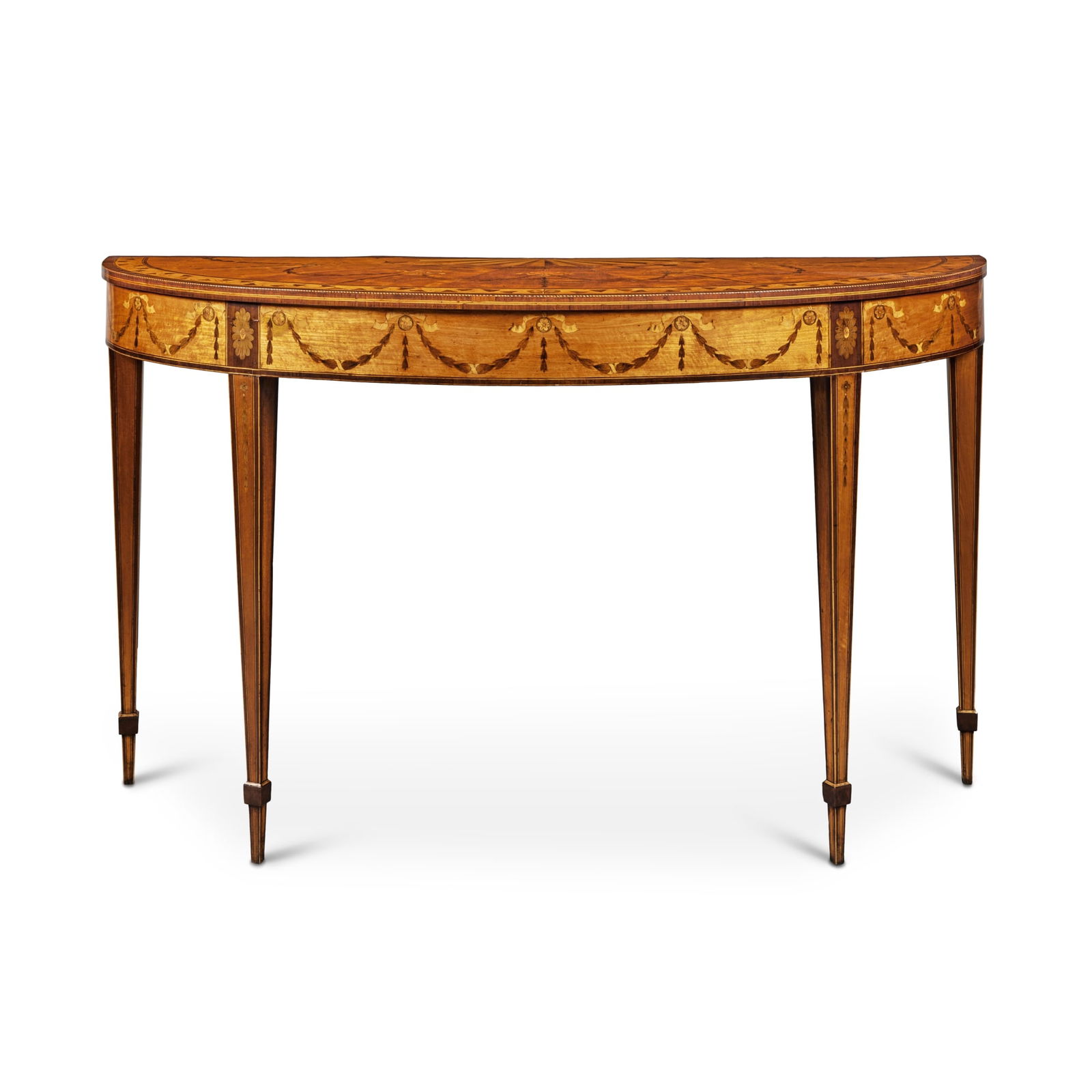 A George III Satinwood, Tulipwood, Kingwood, Amaranth and Stained Sycamore Marquetry Demilune Side: A George III Satinwood, Tulipwood, Kingwood, Amaranth and Stained Sycamore Marquetry Demilune Side Table, Attributed to William Moore of Dublin, Circa 1780 height 36 in.; width 61 1/4 in.; depth 21 1/