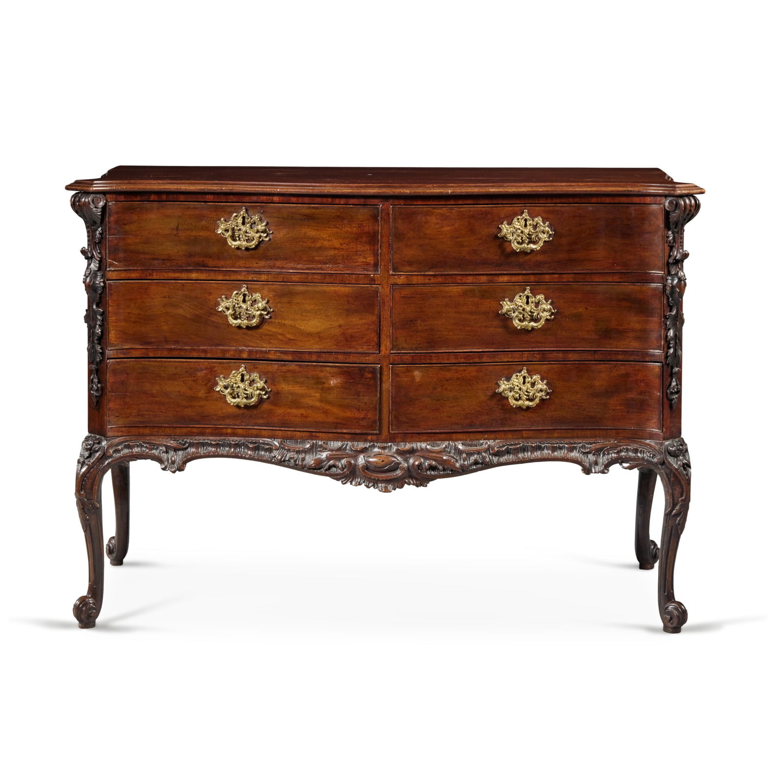 A George III Carved Mahogany Commode in the manner of William Hallett or Thomas Chippendale, Circa: A George III Carved Mahogany Commode in the manner of William Hallett or Thomas Chippendale, Circa 1760 height 36 1/2 in.; width 51 1/2 in.; depth 25 1/2 92.5 cm; 131 cm; 64.8 cm Provenance Carlton H