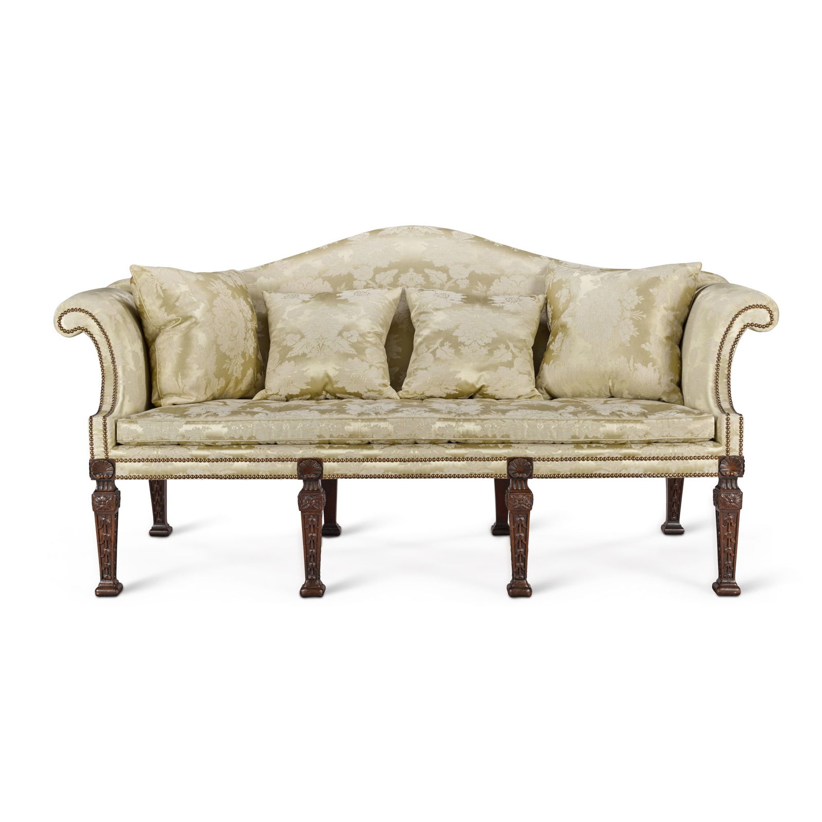 A George II mahogany sofa, circa 1740, after William Kent: A George II mahogany sofa, circa 1740, after William Kent the bow-shaped back and scroll arms covered with later close-nailed satin upholstery, the square legs surmounted by scallop shell and carved w