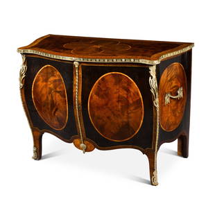 A George III gilt-lacquered brass mounted mahogany, stained sycamore, tulipwood-banded and inlaid: A George III gilt-lacquered brass mounted mahogany, stained sycamore, tulipwood-banded and inlaid commode, circa 1765-70, attributed to John Cobb the serpentine-shaped top inlaid with a central q