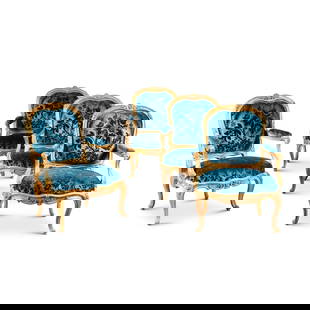 A suite of four Louis XV giltwood armchairs à châssis, three, circa 1750, stamped by: A Louis XV gilt-bronze mounted satinwood and amaranth veneered commode, circa 1750, stamped by BVRB, from the château de Bellevue opening with two drawers, with rocaille mounts, with Saint R