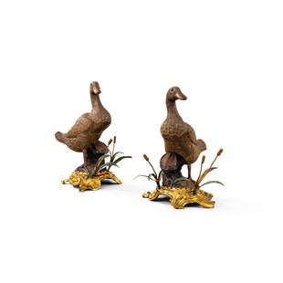 A pair of Louis XV gilt-bronze mounted Chinese ceramic ducks, circa 1750 | Paire de canards en: A pair of Louis XV gilt-bronze mounted Chinese ceramic ducks, circa 1750 (restorations) (2) Height. 9¾ in ------------------------------------------------------------------------------ 