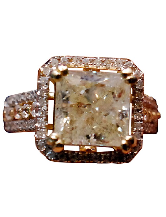 14K Gold Solitaire Diamond Engagement Ring, 3.20cts.: 20th century. 4.8 gram modern "Halo" style 14kt. yellow gold engagement ring. I-2 Clarity, M/N Color. The 3.20cts. Central Solitaire Diamond stone is accented with seventy-two (72) Single Cut Round Di