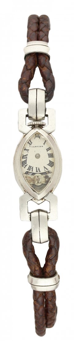 A RARE LADIES SOLID PLATINUM CARTIER AMANDE COCKTAIL: A RARE LADIES SOLID PLATINUM CARTIER AMANDE COCKTAIL WATCH CIRCA 1920s D: Silver dial with applied Roman numerals, visible escapement. M: Manual wind movement numbered. C: Navette shaped case, numbere