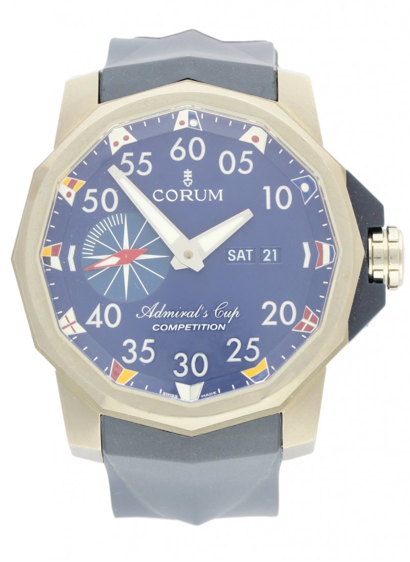 A GENTLEMAN'S TITANIUM CORUM ADMIRALS CUP COMPETITION: A GENTLEMAN'S TITANIUM CORUM ADMIRALS CUP COMPETITION WRISTWATCH CIRCA 2012 WITH BOX & PAPERS D: Blue dial with luminous applied Arabic numerals, day & date apertures, subsidiary seconds, hourly flag