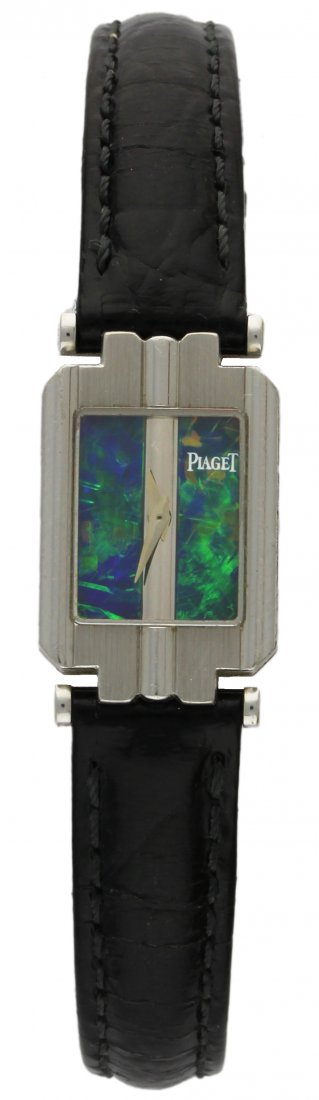 A LADIES 18K SOLID WHITE GOLD PIAGET WRISTWATCH WATCH: A LADIES 18K SOLID WHITE GOLD PIAGET WRISTWATCH WATCH DATED 1995 WITH A RARE OPAL DIAL, ORIGINAL PAPERS D: Opal dial. M: Quartz movement signed Piaget (not working). C: Rectangular case, signed Piaget
