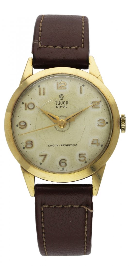 A GENTLEMAN'S 9CT SOLID GOLD ROLEX TUDOR ROYAL: A GENTLEMAN'S 9CT SOLID GOLD ROLEX TUDOR ROYAL WRISTWATCH CIRCA 1960 D: Silver dial with raised gilt Arabic numerals. M: Manual wind movement, signed Tudor. C: Circular case, signed Rolex, numbered & 