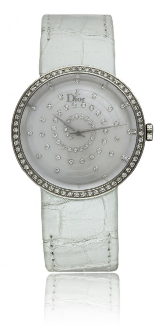 A LADIES STAINLESS STEEL & DIAMOND LA D DE DIOR: A LADIES STAINLESS STEEL & DIAMOND LA D DE DIOR WRISTWATCH CIRCA 2013, REF CD042112A001, WITH BOX & PAPERS D: Mother of pearl dial with diamonds set in a spiral design. M: Quartz movement signed Dior.