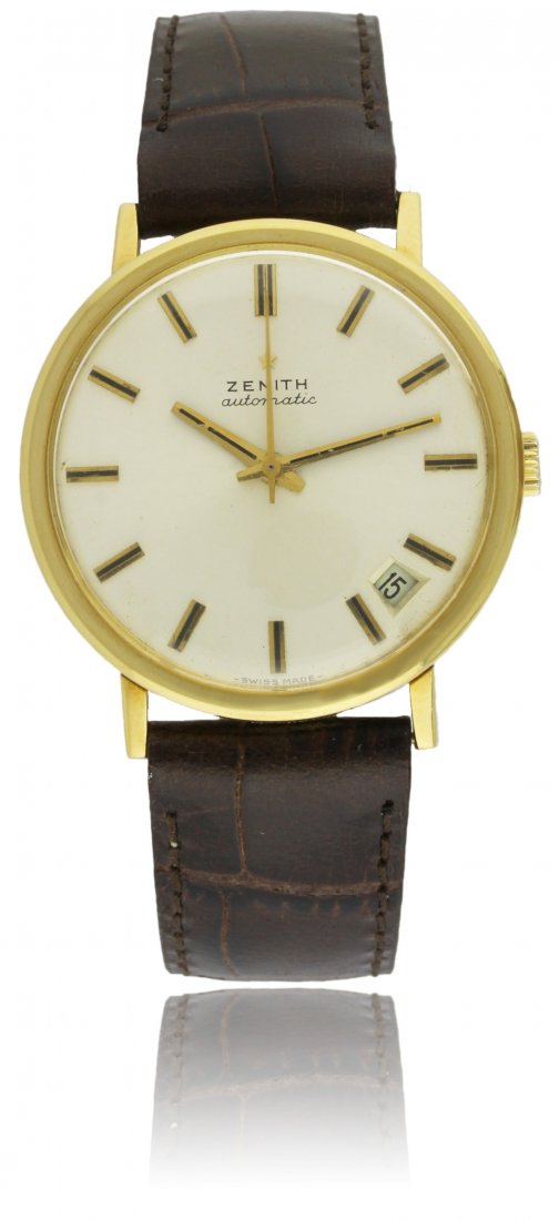 A GENTLEMAN'S 18K SOLID GOLD ZENITH AUTOMATIC: A GENTLEMAN'S 18K SOLID GOLD ZENITH AUTOMATIC WRISTWATCH CIRCA 1970 D: Silver dial with black inlaid gilt batons & hands, date aperture. M: Automatic movement signed Zenith & numbered. C: Circular cas
