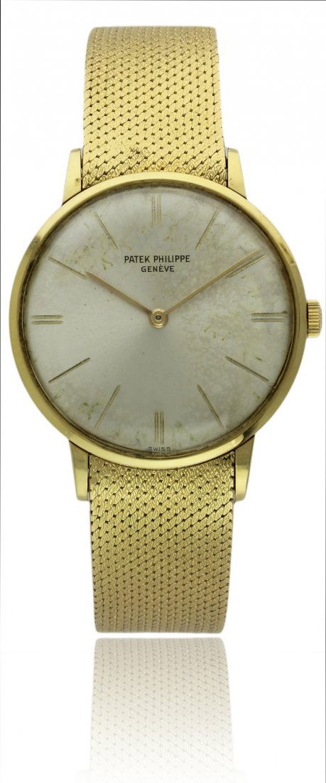 A GENTLEMAN'S 18K SOLID GOLD PATEK PHILIPPE BRACELET: A GENTLEMAN'S 18K SOLID GOLD PATEK PHILIPPE BRACELET WATCH CIRCA 1970s, REF. 3468 D: Silver dial with gilt inset hour markers. M: 18 jewel manual wind movement, signed Patek Philippe & Co., numbered,