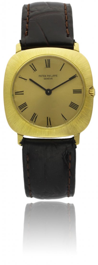 A GENTLEMAN'S 18K SOLID GOLD PATEK PHILIPPE WRISTWATCH: A GENTLEMAN'S 18K SOLID GOLD PATEK PHILIPPE WRISTWATCH CIRCA 1980, REF. 3543 D: Champagne dial with applied Roman numerals. M: 18 jewel manual wind movement, signed Patek Philippe & Co., numbered, cal