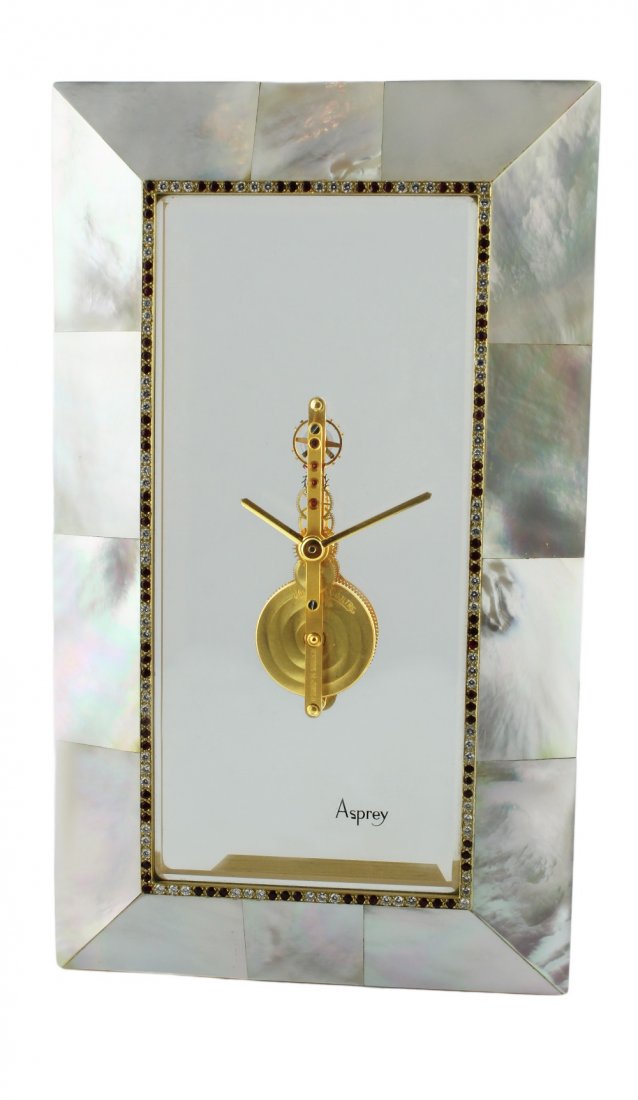AN EXTREMELY FINE & RARE MOTHER OF PEARL, DIAMOND &: AN EXTREMELY FINE & RARE MOTHER OF PEARL, DIAMOND & RUBY SET JAEGER LECOULTRE "SKELETON" MANTLE CLOCK CIRCA 1990s RETAILED BY ASPREY WITH ORIGINAL INNER & OUTER BOXES D: Clear perspex dial signed Aspr