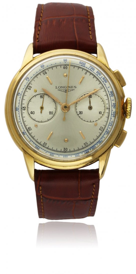 A RARE GENTLEMAN'S 18K SOLID GOLD LONGINES 13ZN: A RARE GENTLEMAN'S 18K SOLID GOLD LONGINES 13ZN CHRONOGRAPH WRISTWATCH CIRCA 1950s D: Silver dial with raised gilt hour markers, double register recording minutes & continuous seconds. M: Manual wind