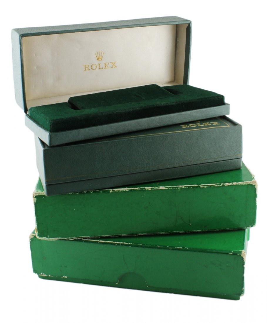 FOUR RECTANGULAR ROLEX WRIST WATCH BOXES CIRCA 1960/70s: FOUR RECTANGULAR ROLEX WRIST WATCH BOXES CIRCA 1960/70s Green vinyl covered cases (two with outer boxes), silk and green felt interiors, signed Rolex, diameter is approx 15.4cm/6.2cm/3.5cm.