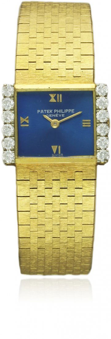 A FINE LADIES 18K SOLID GOLD & DIAMOND PATEK PHILIPPE: A FINE LADIES 18K SOLID GOLD & DIAMOND PATEK PHILIPPE BRACELET WATCH DATED 1974, REF. 3368/2 WITH ORIGINAL BOX & PAPERWORK D: Sunburst blue dial with quarterly raised gilt Roman numerals. M: 20 jewel