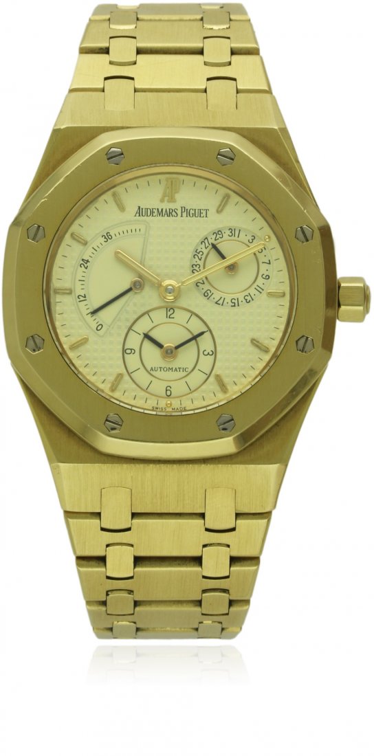 A FINE GENTLEMAN'S 18K SOLID GOLD AUDEMARS PIGUET ROYAL: A FINE GENTLEMAN'S 18K SOLID GOLD AUDEMARS PIGUET ROYAL OAK DUAL TIME BRACELET WATCH DATED 1991, REF. 25730BA, WITH ORIGINAL BOX & PAPERS D: Ivory coloured clous de Paris dial with luminous inlaid gol