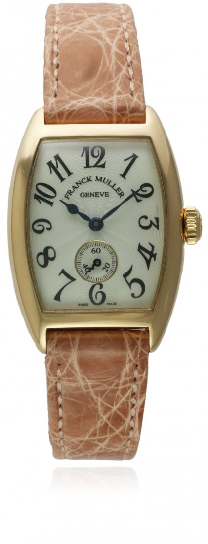A LADIES 18K SOLID GOLD FRANCK MULLER CINTREE CURVEX: A LADIES 18K SOLID GOLD FRANCK MULLER CINTREE CURVEX WRIST WATCH DATED 2002, REF. 1752 S6 WITH BOX & PAPERS D: Silver guilloche dial with applied Arabic numerals, subsidiary seconds. M: Manual wind mo