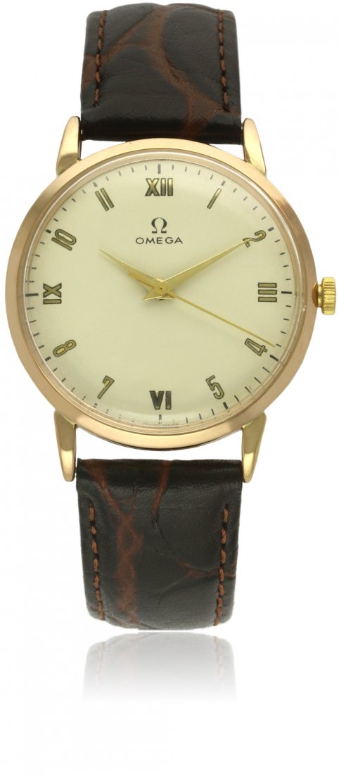 A GENTLEMAN'S 18K SOLID GOLD OMEGA ''BUMPER'' AUTOMATIC: A GENTLEMAN'S 18K SOLID GOLD OMEGA ''BUMPER'' AUTOMATIC WRIST WATCH CIRCA 1950s D: Silver dial with applied gilt mirrored Arabic & Roman numerals, dauphine hands. M: 17 jewel automatic movement, signe