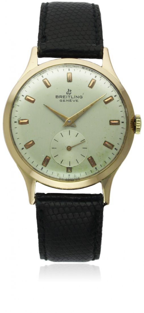 A GENTLEMAN'S 18K SOLID GOLD BREITLING WRIST WATCH: A GENTLEMAN'S 18K SOLID GOLD BREITLING WRIST WATCH CIRCA 1950s, REF. 211 19 D: Silver dial with gilt inset batons, subsidiary seconds. M: 17 jewel manual wind movement, signed Breitling, calibre 19. C