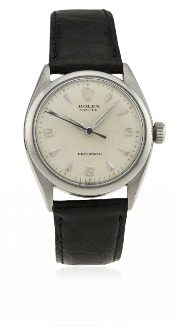 A GENTLEMAN'S STAINLESS STEEL ROLEX OYSTER PRECISION: A GENTLEMAN'S STAINLESS STEEL ROLEX OYSTER PRECISION WRIST WATCH CIRCA 1956, REF. 6480 D: Quartered silver textured dial with silver "arrowhead" markers & quarterly Arabic numerals, "dagger" hands. M: