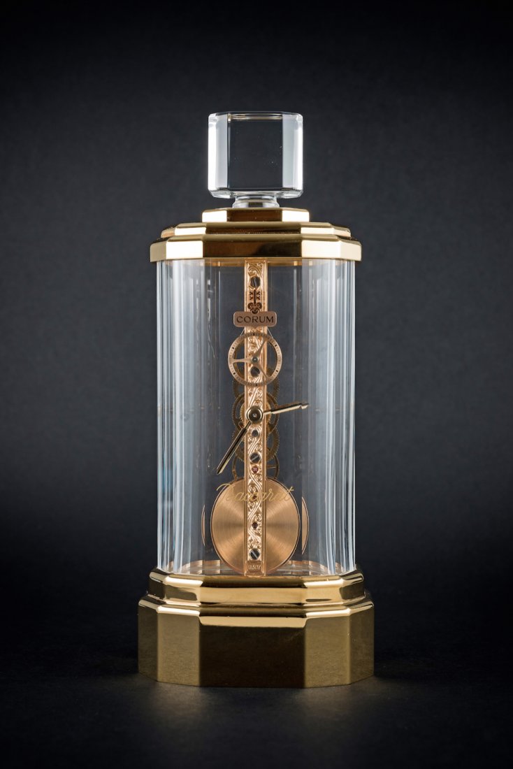 A FINE & RARE BACCARAT CRYSTAL CORUM GOLDEN BRIDGE: A FINE & RARE BACCARAT CRYSTAL CORUM GOLDEN BRIDGE MANTEL CLOCK CIRCA 1990s, WITH ORIGINAL BOX NUMBERED 323 M: Quartz driven mechanical golden bridge inline movement with continuous seconds wheel, sig